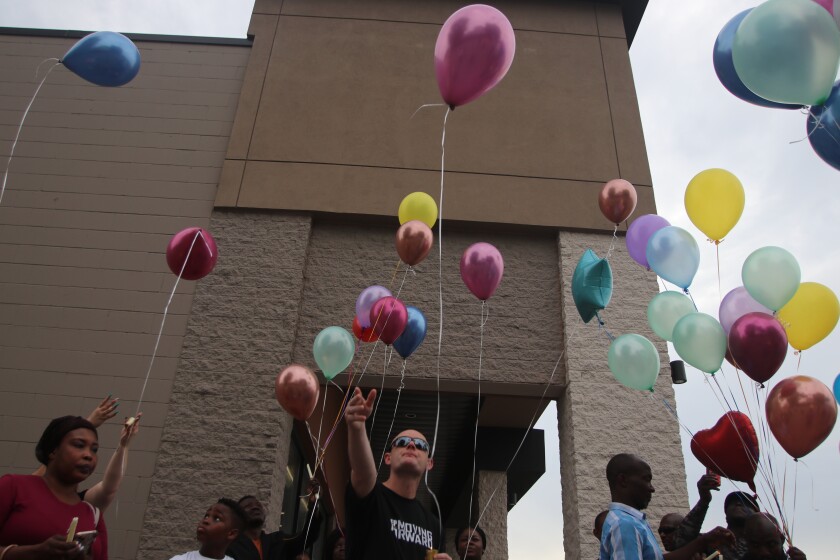 Robert Paulsen, father of Daisy 'Jupiter' Paulsen, releases his ballon during a candlelight service for his daughter killed earlier in June on Friday, June 25, 2021.jpg