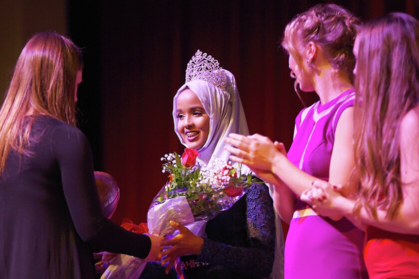 Briana Sanchez / TribuneAnisa Abdulahi is crowned homecoming queen at Willmar Senior High School Monday night. Abdulahi and Christian Grant Duininck were named homecoming queen and king.