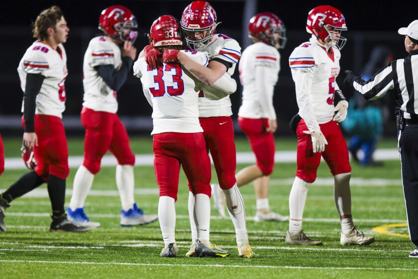 football players hugging