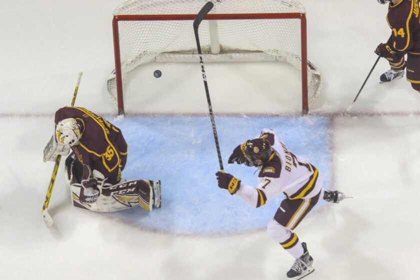 College hockey game in an indoor arena