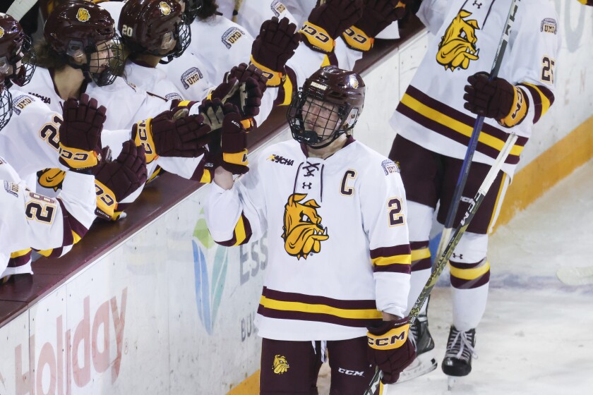 college women play hockey at arena