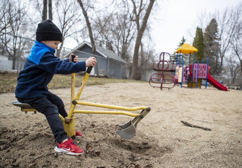 William Saunders, 4, digs for buried treasure while playing at Canigo Park on Thursday, April 28, 2022, in downtown Willmar.