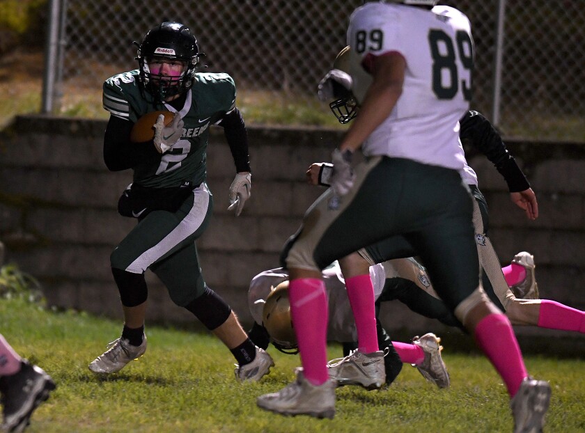 Northwood/Solon Springs’ Abe Ahlberg (2) runs over a Chequamegon defender