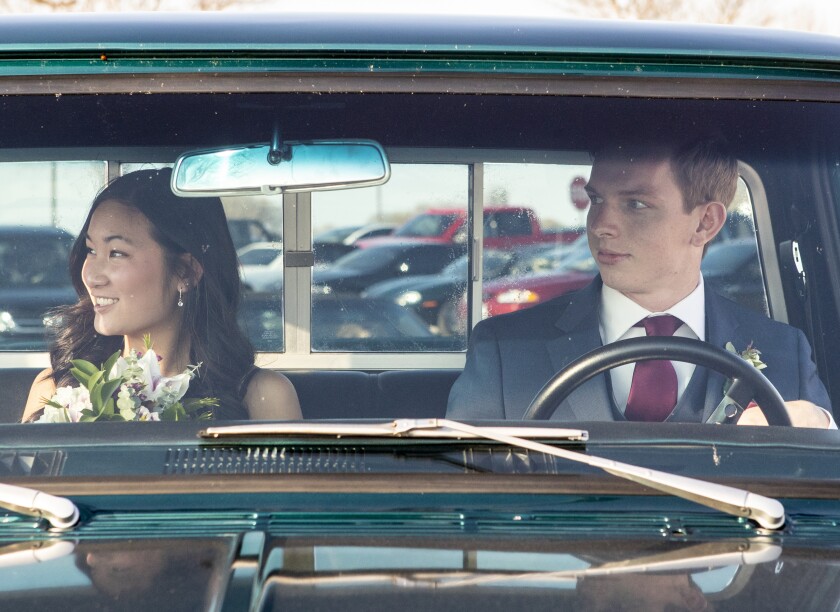 Students pull up in front of Willmar High School in style as they prepare to dance the night away at prom Friday, May 6, 2022.
