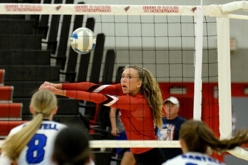 Willmar senior Sydney Schnichels bumps the ball over the net during a Central Lakes Conference match against Sartell on Tuesday, Sept. 27, 2022 at the Big Red Gym at Willmar High School.