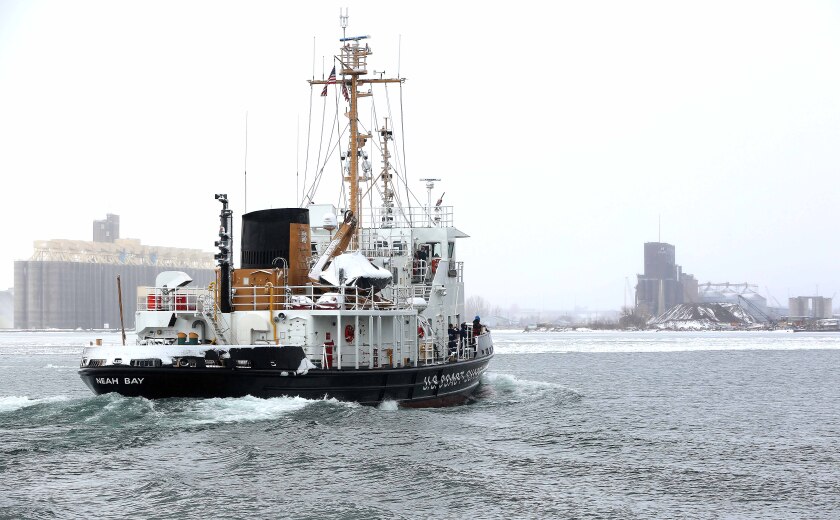 Coast Guard tugboat travels on water