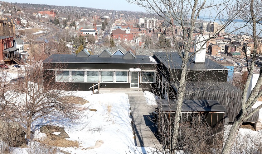View of house and hillside.
