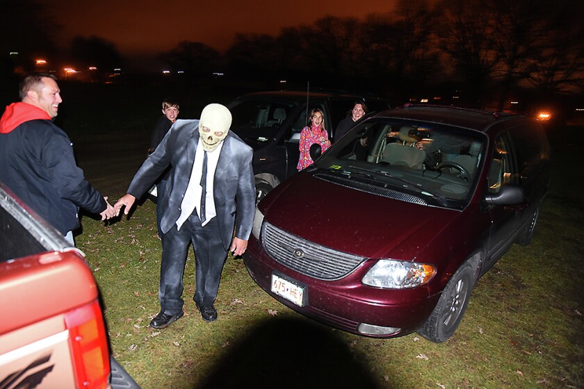 Briana Sanchez / TribuneDaniel Schanus, president of the Willmar Nite Lions, gives people one last scare before they get in their cars Sunday night after the Deegers Feak Show haunted house. The haunted house was put on by the Willmar Noon and Nite Lions. Regular admission is $10. Admission is $8 with the donnation of a canned food item for the Willmar Area Food Shelf.