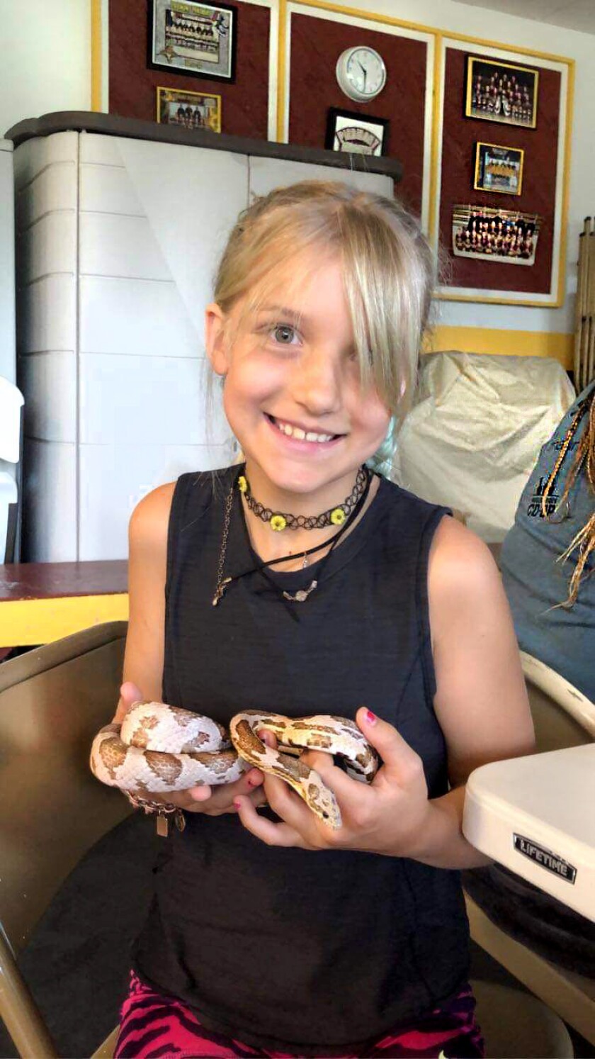 Esmé Nordstrom holds a snake.