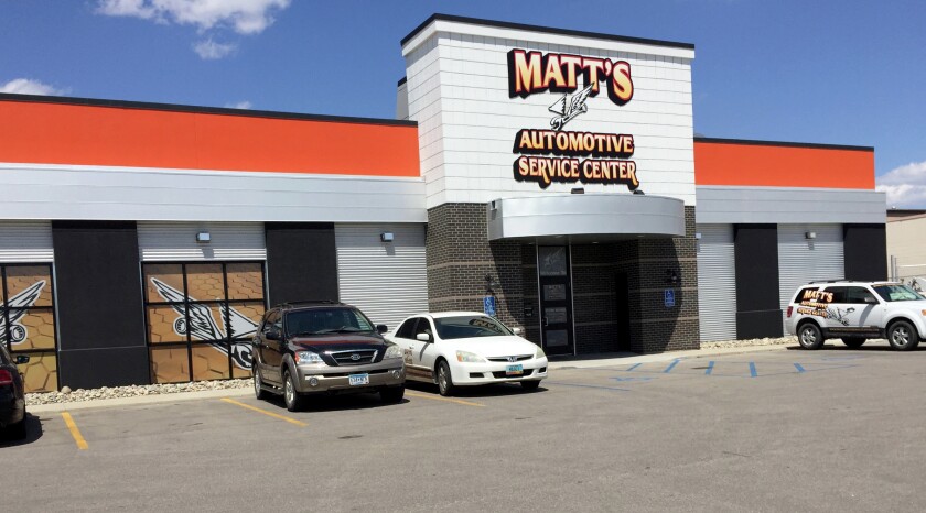 Matt Lachowitzer stands behind the service counter of the new Matt's Automotive Service Center in Fargo on Tuesday, June 2. He opened his first shop in Moorhead June 1, 2009.