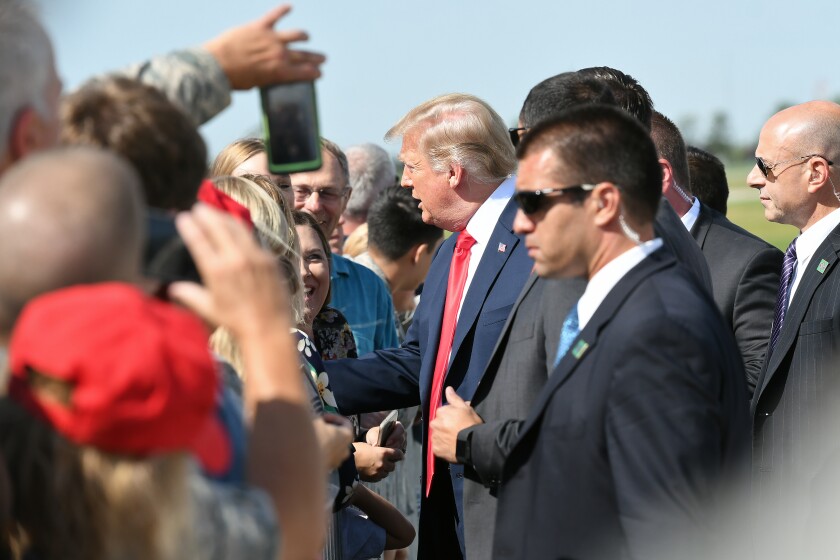President Donald Trump greets members of the military and their families Friday, Sept. 7, at the North Dakota Air National Guard Base in Fargo. Michael Vosburg / Forum Photo Editor