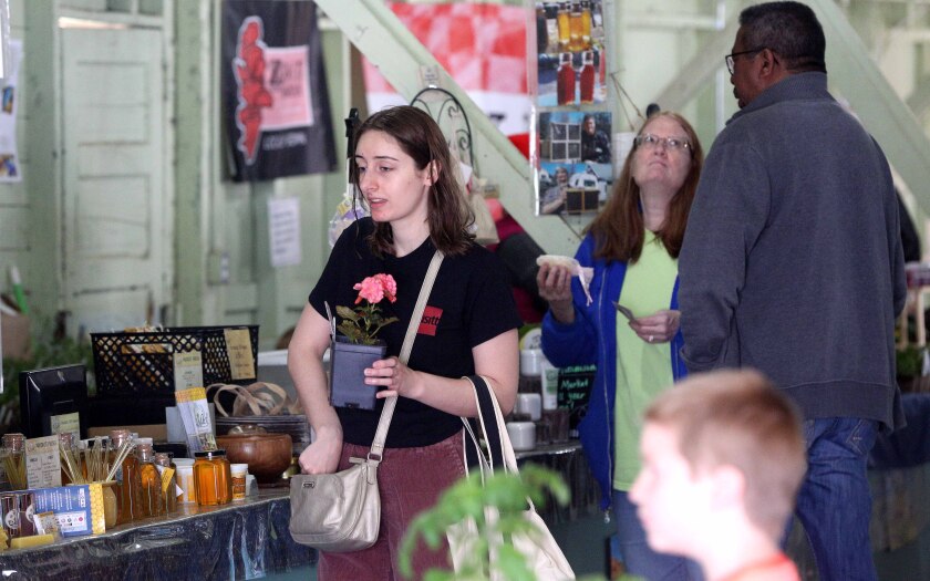 woman carrying a flower