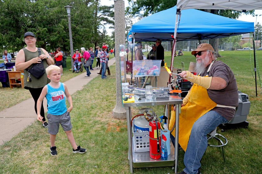 People attend Arts in the Park on Sunday, June 26, 2022, at Gregory Park in Brainerd.