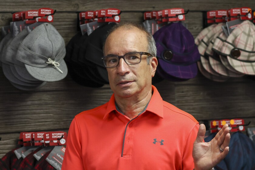 Wool caps with ear bands being made in factory