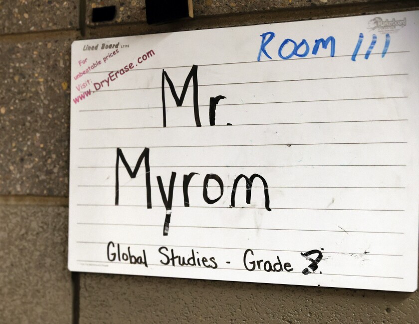 A sign outside the classroom of Worthington Middle School eighth grade global studies teacher Lonnie Myrom is shown on Wednesday, April 26, 2023.