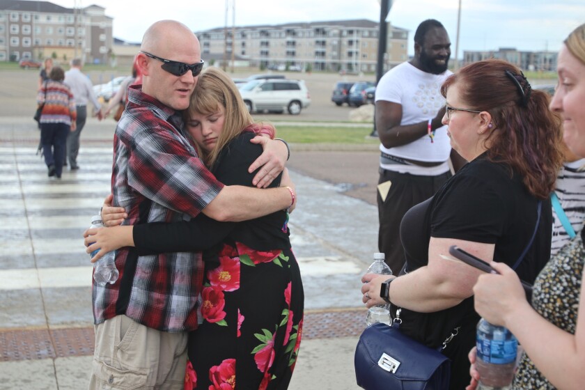 Robert Paulsen, father of Daisy 'Jupiter' Paulsen, giving comfort to family and friends after the service Sunday, June 27, 2021 at Scheels Arena (1).jpg