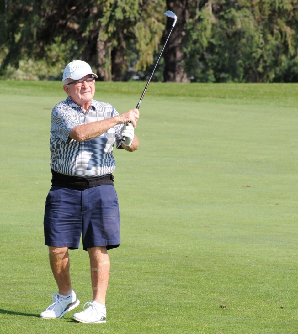Gene Sipe tries to land an approach shot from the fairway on the