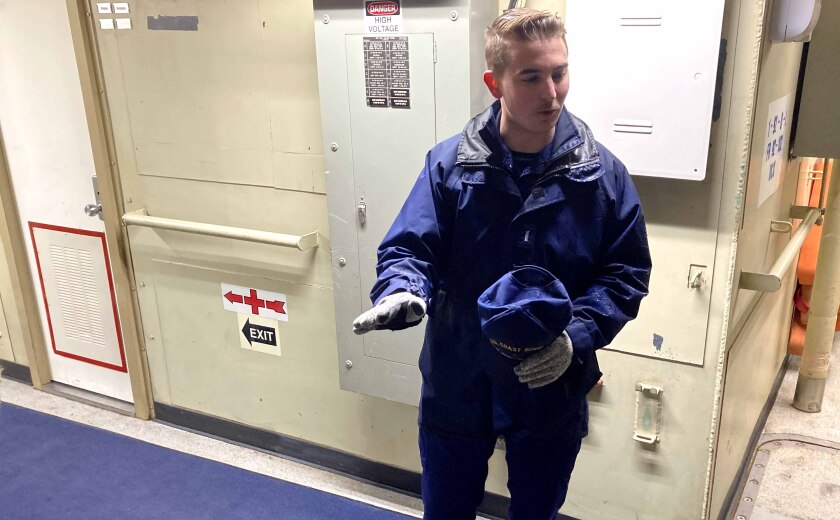 coast guard member gives tour