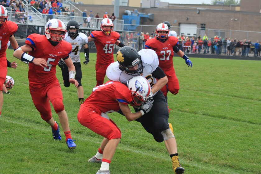 Perham's Jack DeConcini lowers his shoulder into Pequot Lakes' Hunter Clement and drives him back for a gain in the fourth quarter. Jason Groth/FOCUS