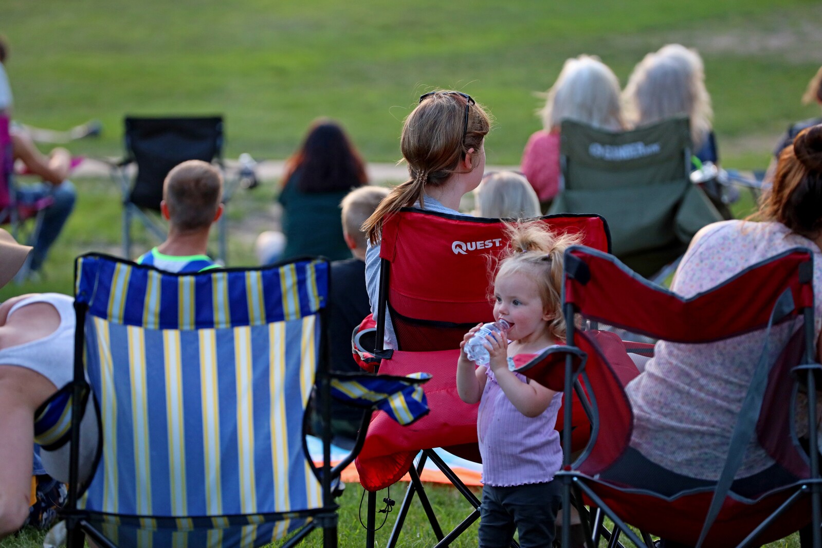People enjoy a concert in the park