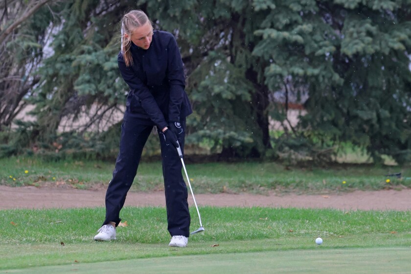 Brainerd's Meredith Holmstrom putts the ball onto the green on Thursday, May 1, 2025, at Pine Beach East Golf Course at Madden’s.
