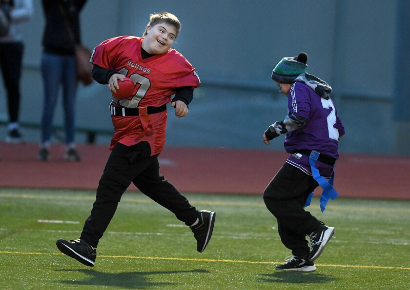 Duluth East’s Gavin Reller (10) flashes a big smile as he scores a touchdown in front of Cloquet’s Gentry Olson