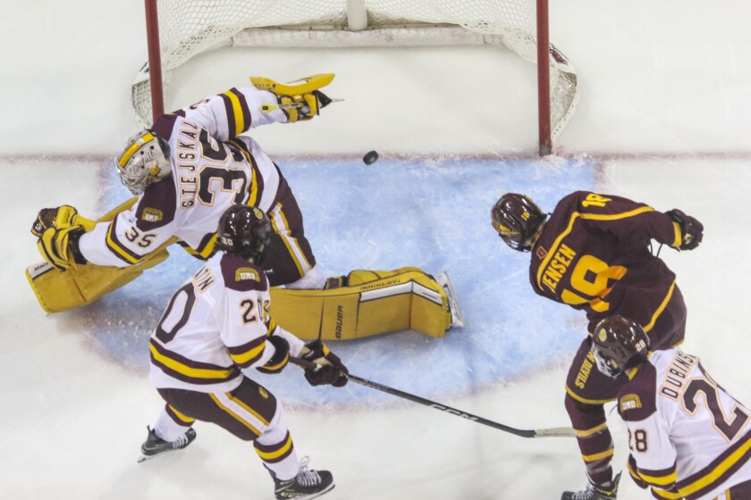College hockey game in an indoor arena