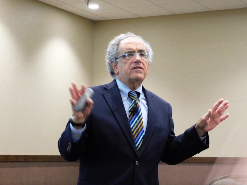 Shelby Lindrud / Tribune William Blazar, retired senior vice president of the Minnesota Chamber of Commerce, spoke in Willmar Thursday about the economic impacts of immigration in Minnesota.