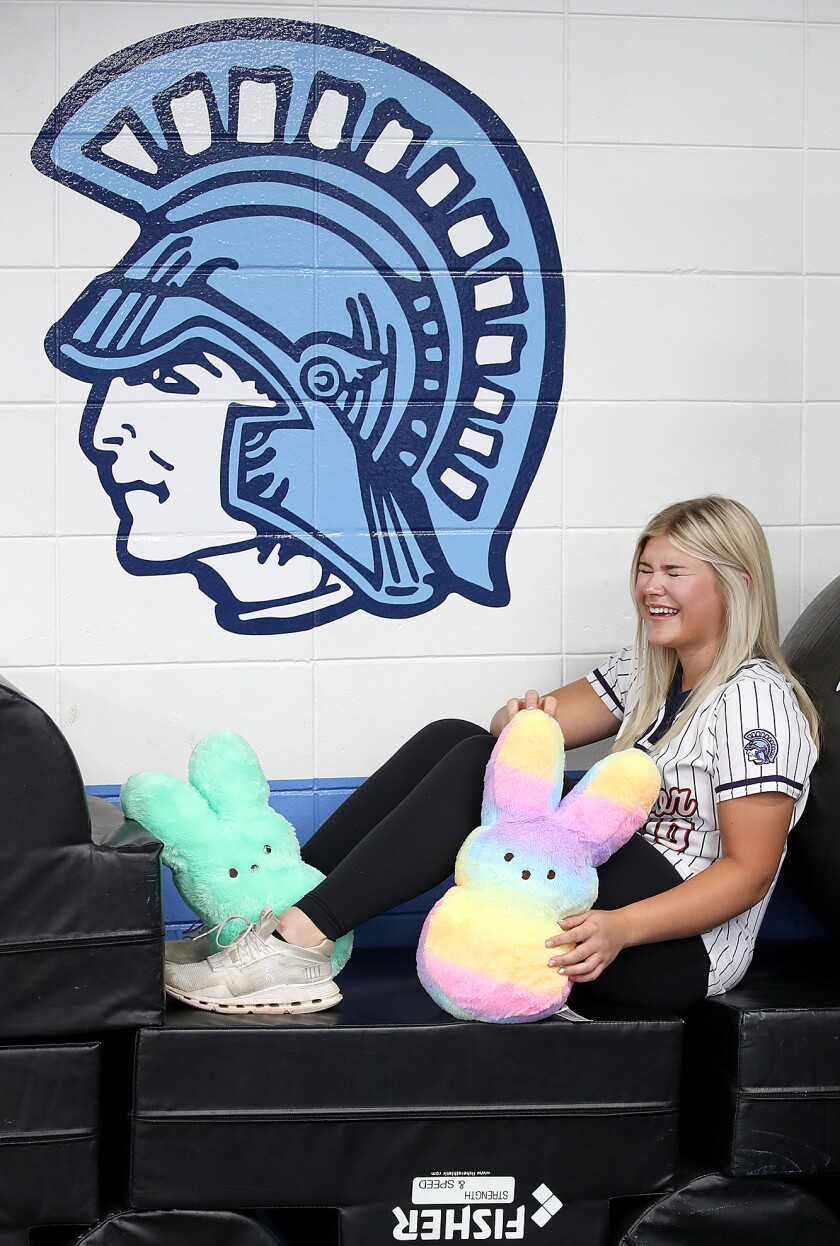 Player laughs with stuffed animals.