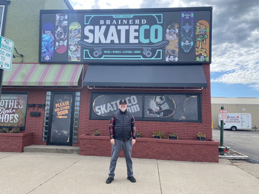 Anton "Andy" Dabbs the owner of Brainerd Skate Company poses for a photo.