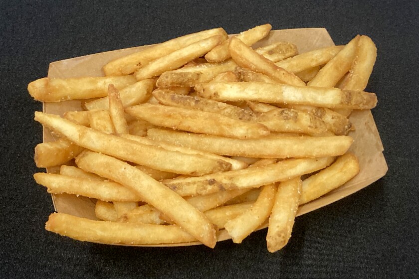 French fries served in a paper tray.