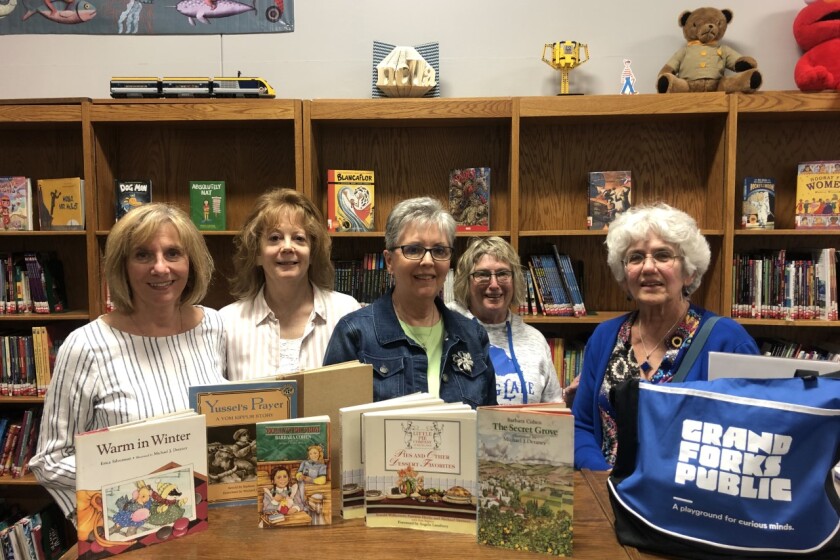 St. James alumnae donate children’s books, illustrated by their