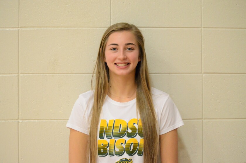 Lexi Jordheim, a senior at Dickinson High tests out her future school's colors of yellow and green by wearing an NDSU t-shirt. (Shelby Reardon / The Dickinson Press)