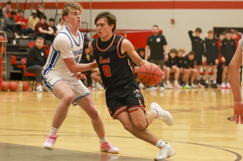 high school boys play basketball