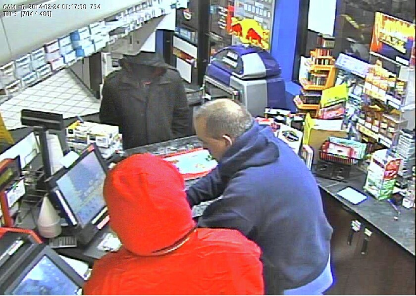 Police release surveillance video images of armed convenience store ...