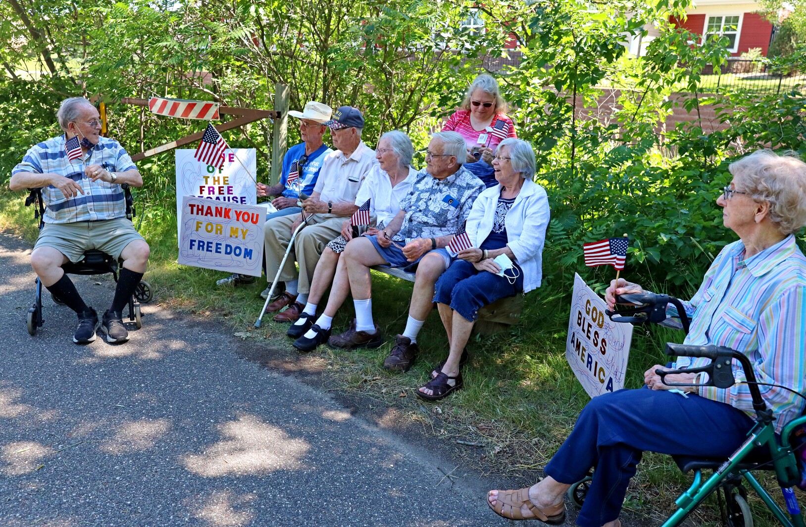 Residents from Northern Lakes Assisted Living attend the Armed Forces Veterans Tribute Day Walk-Bike-Stroll on the Paul Bunyan Trail on Friday, July 22, 2022, in Baxter.