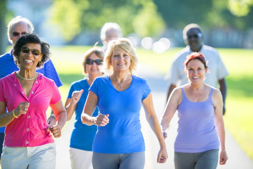 A group of men and women are out walking