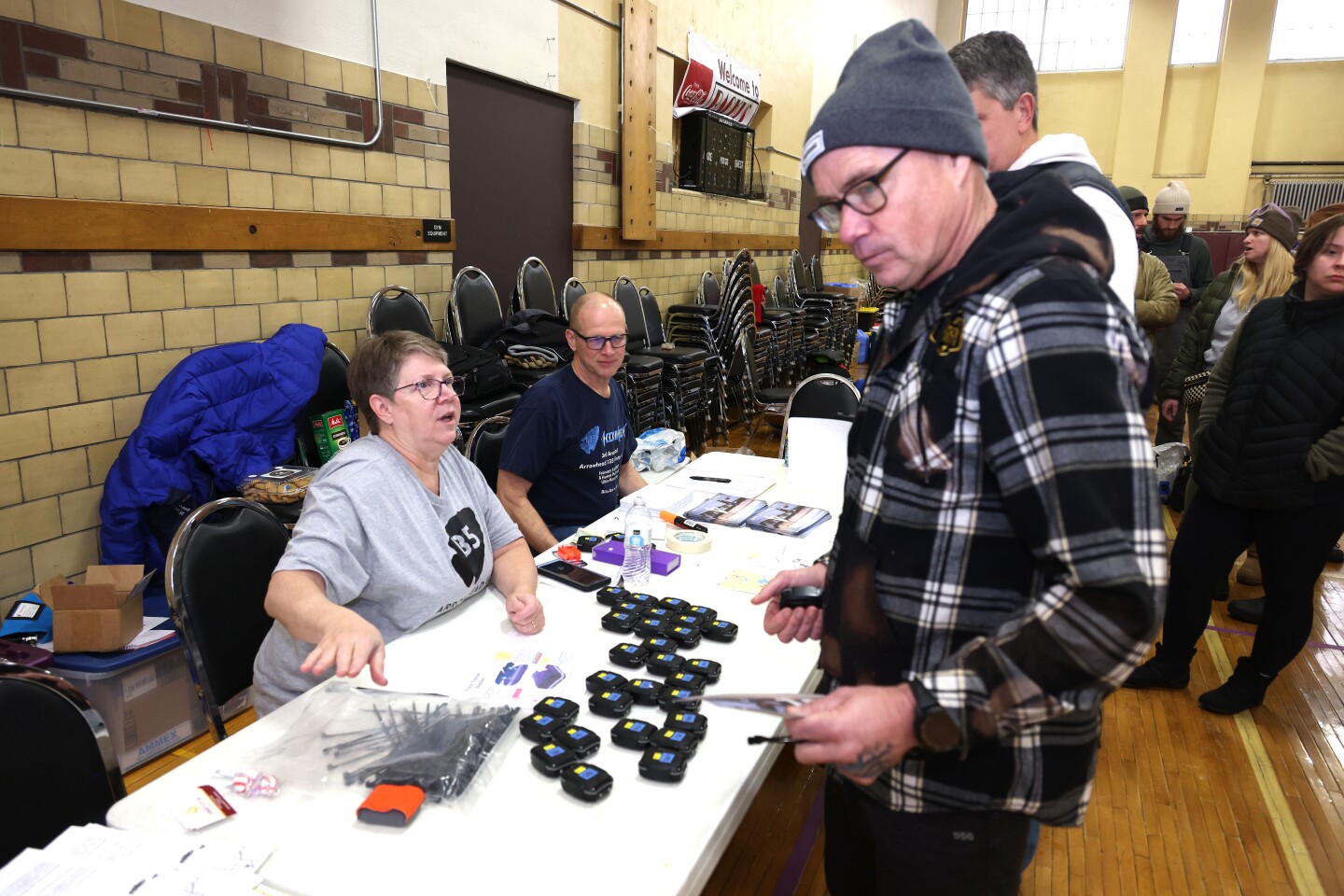 Volunteer helps racer at check in