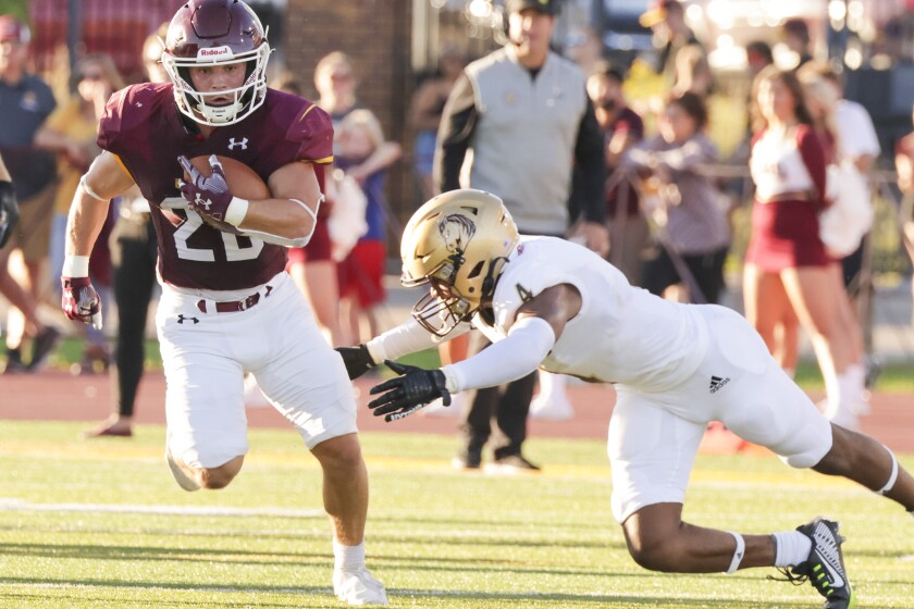Football player playing in outdoor stadium