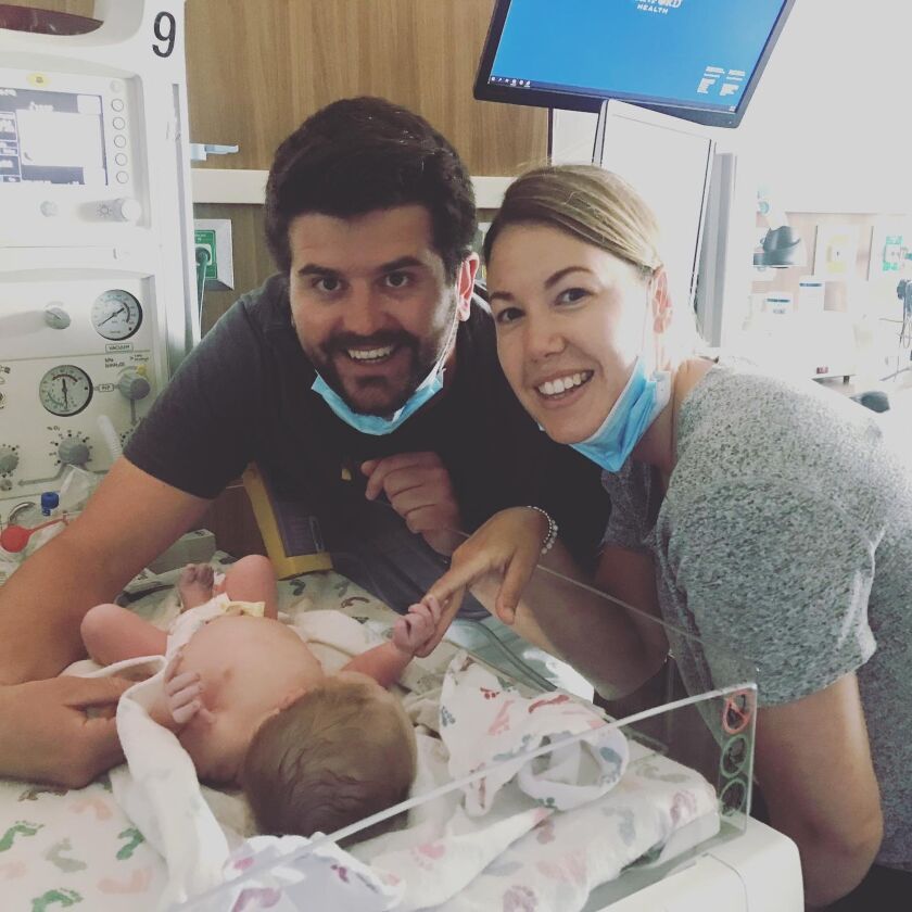 Karli_Taylor and Kari with second born, Simon, on his birth day, 2020.jpg