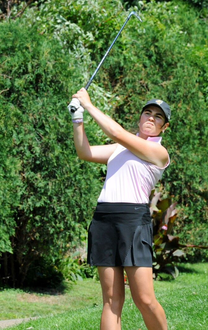 Alayna Eldred launches her tee shot towards the Minnesota-shaped