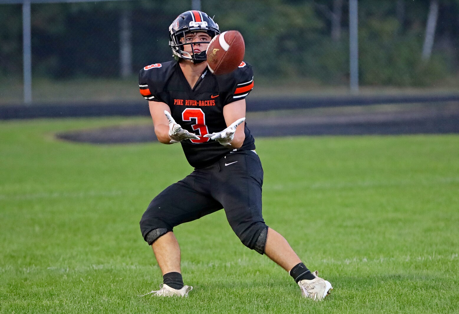 Pine River-Backus football player catches the ball for a touchdown.