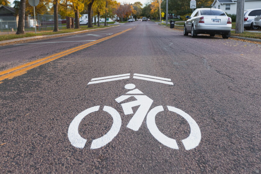 City paints bicycle signs along Mitchell roads to alert drivers, as ...