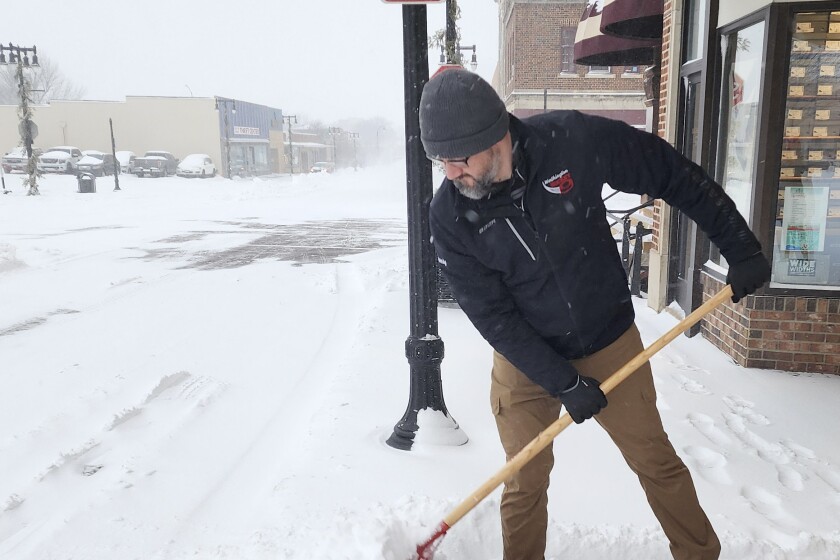 PHOTOS: Snow removal efforts are underway as wintry weather  PHOTOS: Snow removal efforts are underway as wintry weather