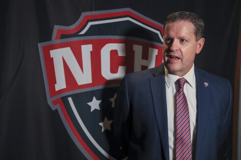 College hockey players and coaches in interviews