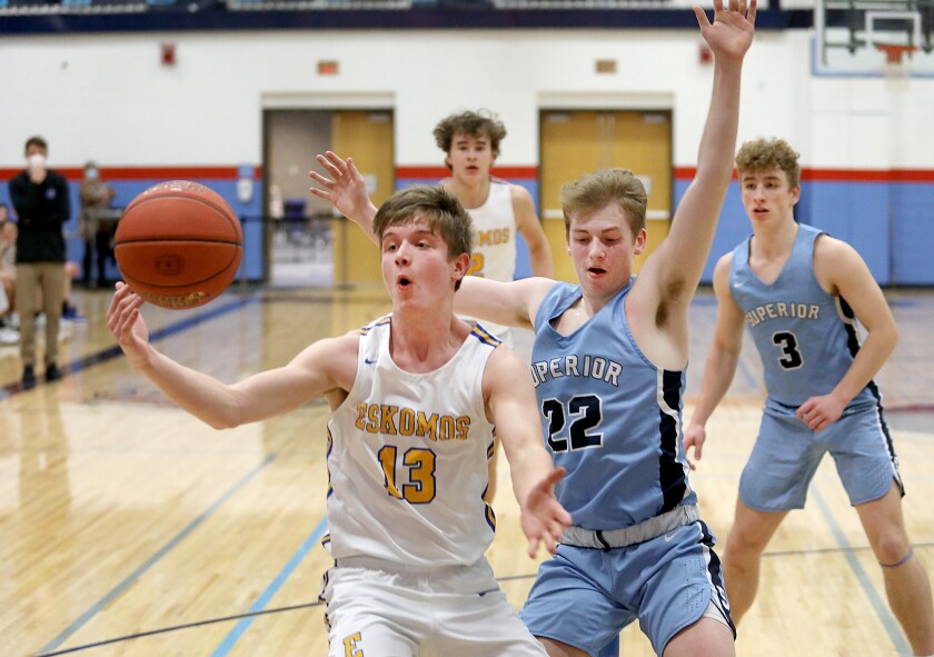 Esko’s Nicholas Swanson (13) grabs a loose ball in front of Superior’s Evan Bennett (22)