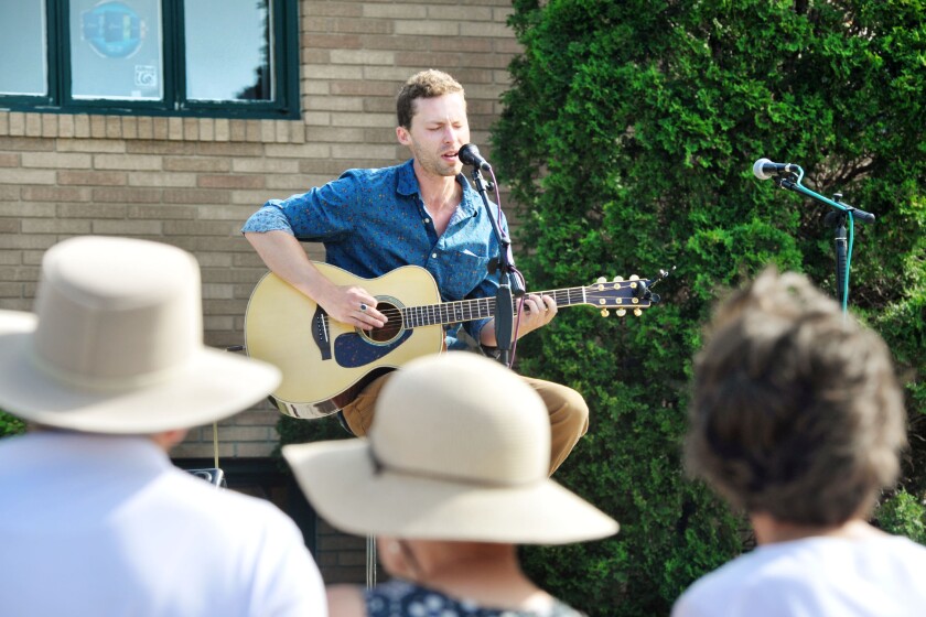 Man playing guitar for audience