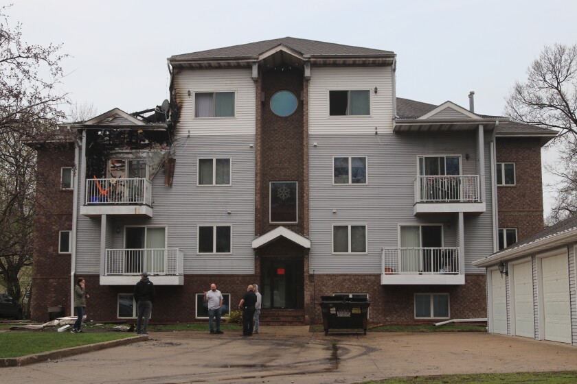 Apartment complex managers and others prepare to help residents retrieve their belongings on Thursday, May 12, 2022.jpg