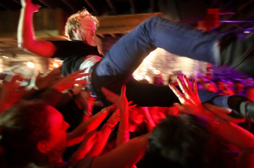 t5.4.18 Bob King -- 050518.N.DNT.HOMEGROWNc2 -- Alan Sparhawk, singer with the Black-eyed Snakes, crowd surfs during a Homegrown performance at the Red Herring Lounge Friday night. Bob King / rking@duluthnews.com