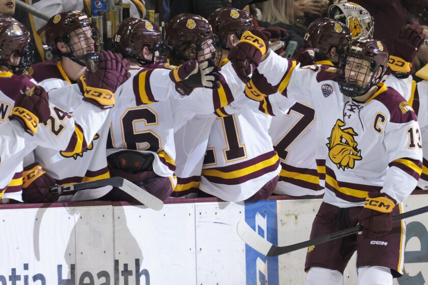 college men play hockey